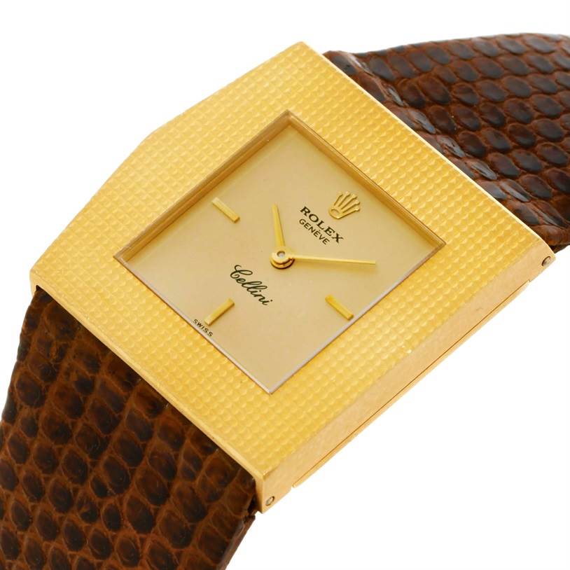 This image shows a close-up, angled view of a Rolex Cellini 4126 Men's Yellow Gold Champagne Dial 4126 Men's Yellow Gold Champagne Dial watch, highlighting the gold square dial and brown strap.