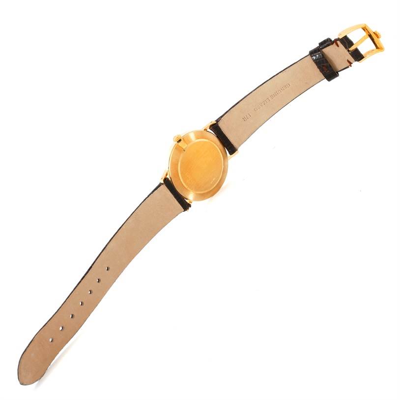 The image shows the back case and strap of a Rolex Cellini 4112 Yellow Gold Champagne Dial 4112 Yellow Gold Champagne Dial watch laid flat, viewed from above.