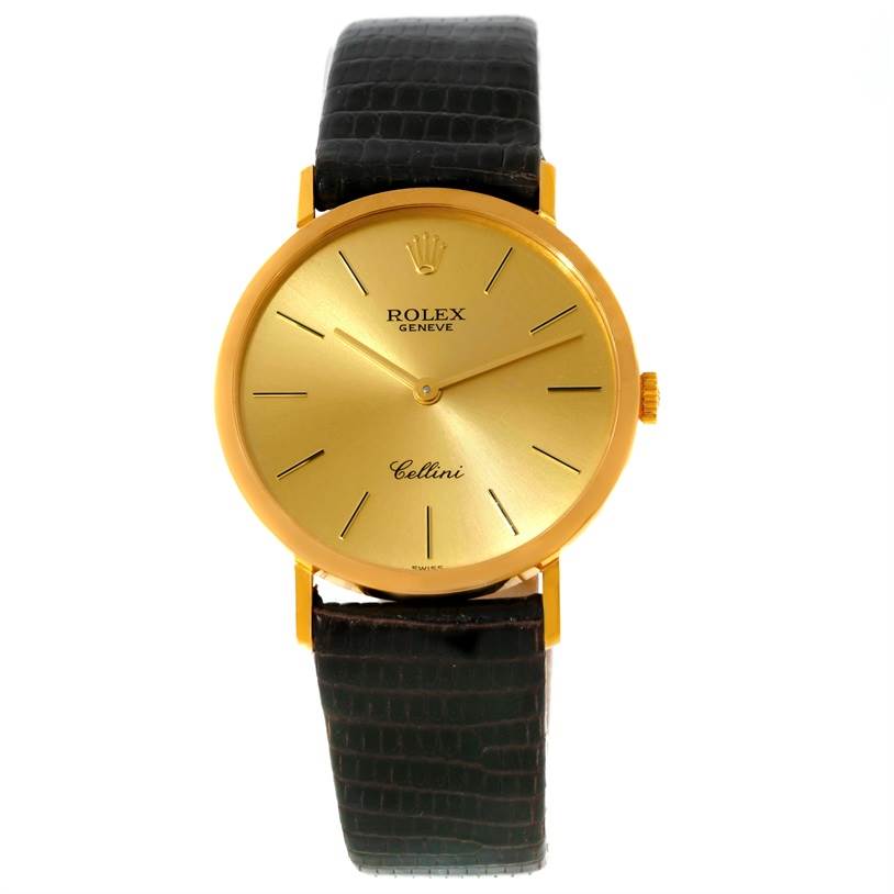 The Rolex Cellini 4112 Yellow Gold Champagne Dial 4112 Yellow Gold Champagne Dial watch is shown from the front, displaying the gold dial, black leather strap, and minimalistic hour markers.