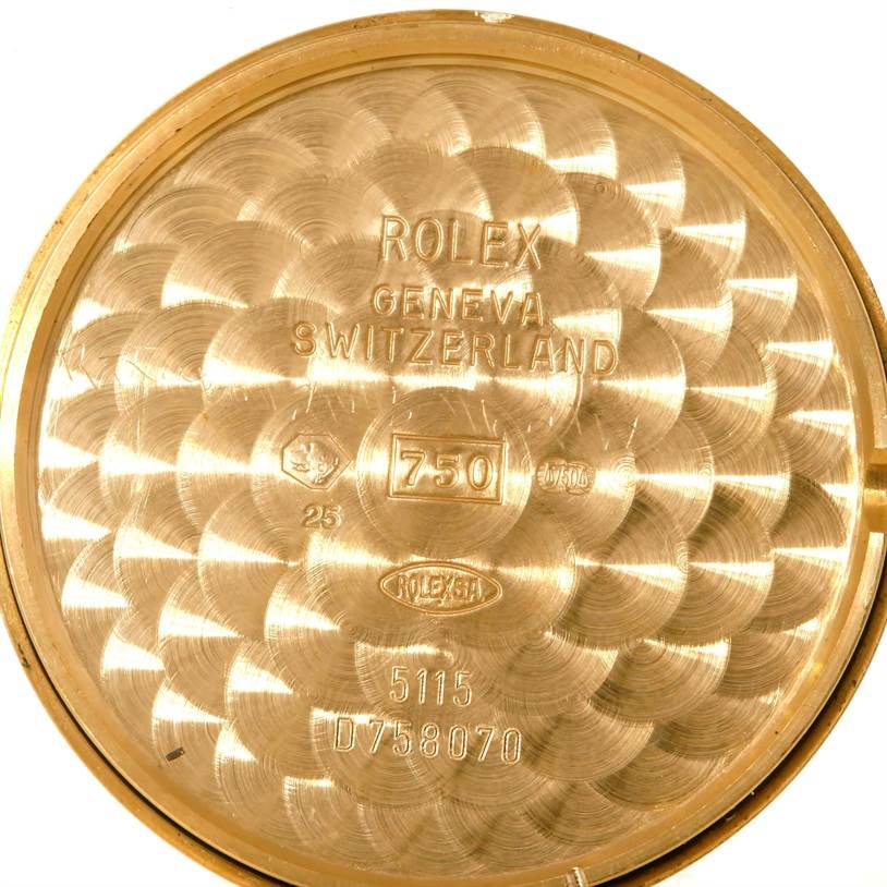 The image shows the inside case back of a Rolex Cellini 5115 Men
s Yellow Gold Black Dial 5115 Men
s Yellow Gold Black Dial watch, with model and serial numbers visible.