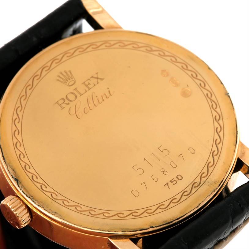 The image shows the case back and part of the strap of a Rolex Cellini 5115 Men
s Yellow Gold Black Dial 5115 Men
s Yellow Gold Black Dial watch, viewed from the rear angle.