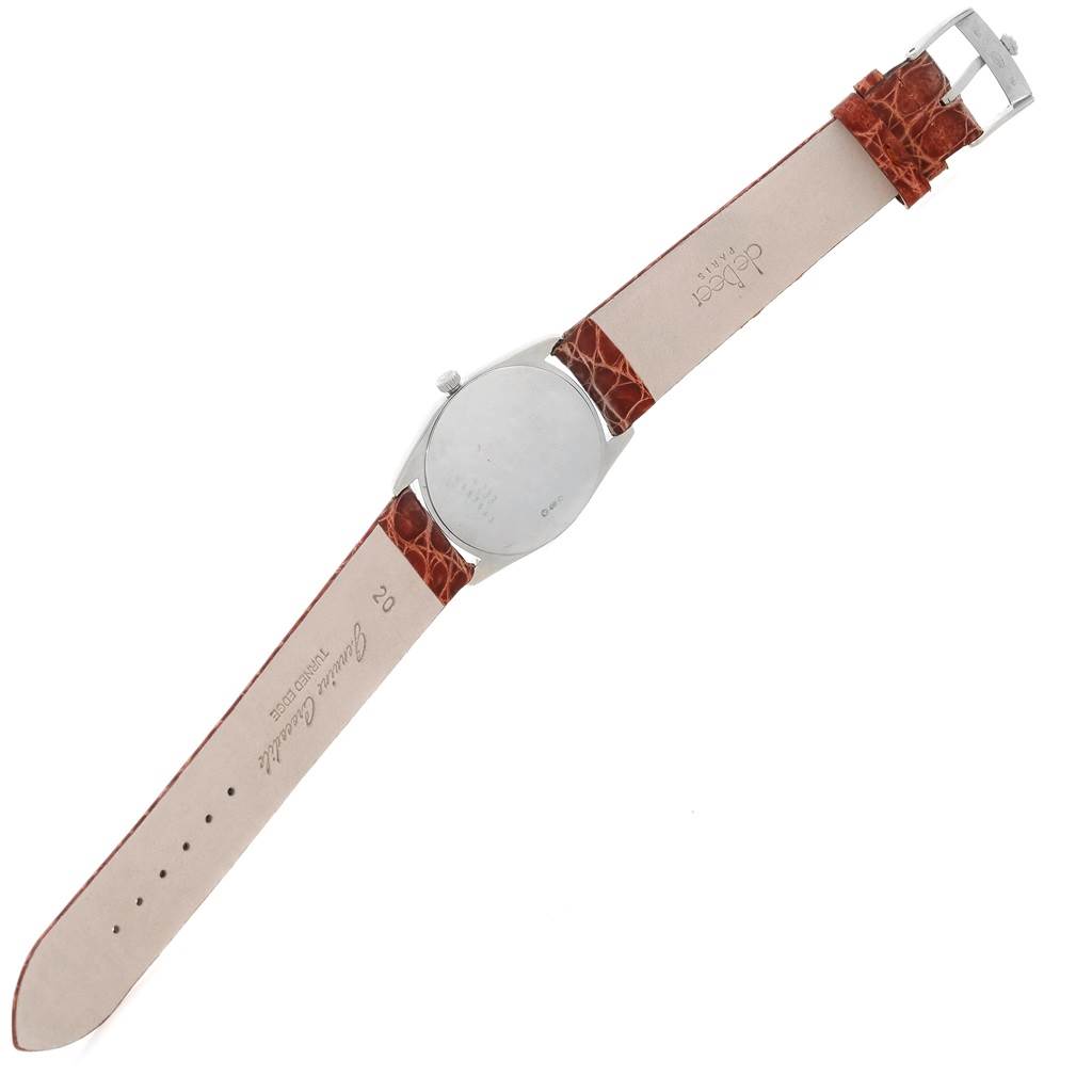 The image shows the back view of the Rolex Cellini 4233 Men's White Gold Black Dial 4233 Men's White Gold Black Dial watch with its case and extended leather strap.