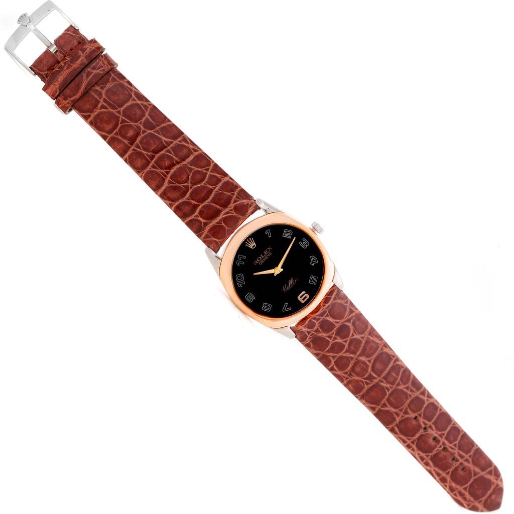 The Rolex Cellini 4233 Men's White Gold Black Dial 4233 Men's White Gold Black Dial watch is shown from a top-down angle, clearly displaying the face, bezel, crown, and leather strap.