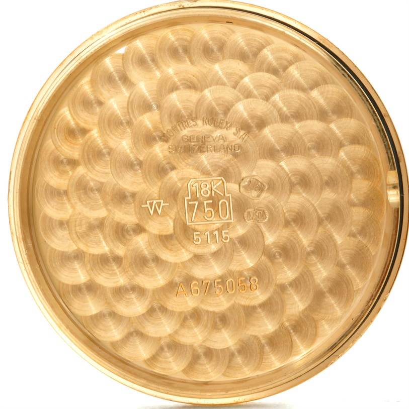 This image shows the inner case back of a Rolex Cellini 5115 Men's Yellow Gold Black Dial 5115 Men's Yellow Gold Black Dial model watch, made of 18K gold.