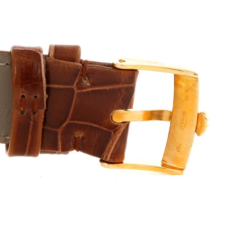 This image shows a close-up of the brown leather strap and gold buckle from a Rolex Cellini 5115 Men
s Yellow Gold Mother of Pearl Dial 5115 Men
s Yellow Gold Mother of Pearl Dial watch.