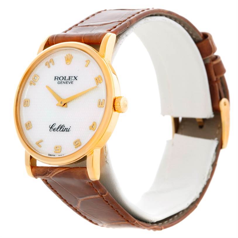 The image shows a Rolex Cellini 5115 Men
s Yellow Gold Mother of Pearl Dial 5115 Men
s Yellow Gold Mother of Pearl Dial watch from a front-left angle, featuring its dial, hands, and leather strap.