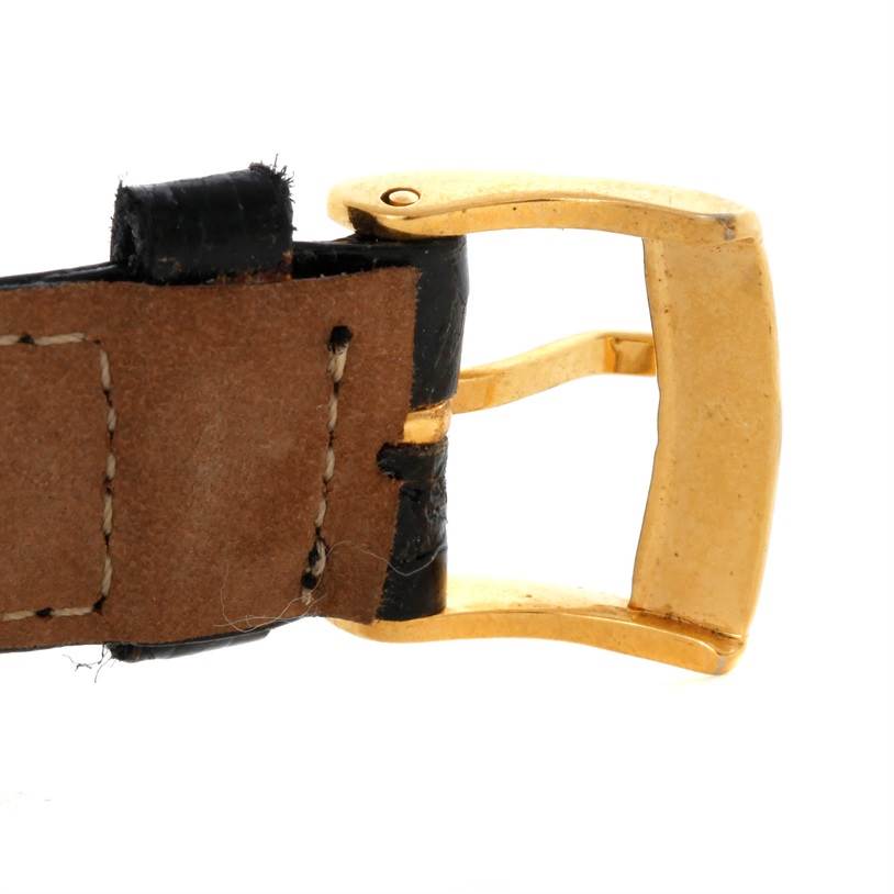 The image shows a close-up of the buckle and part of the strap of a Rolex Cellini 5112 Men
s Yellow Gold Champagne Dial 5112 Men
s Yellow Gold Champagne Dial watch.