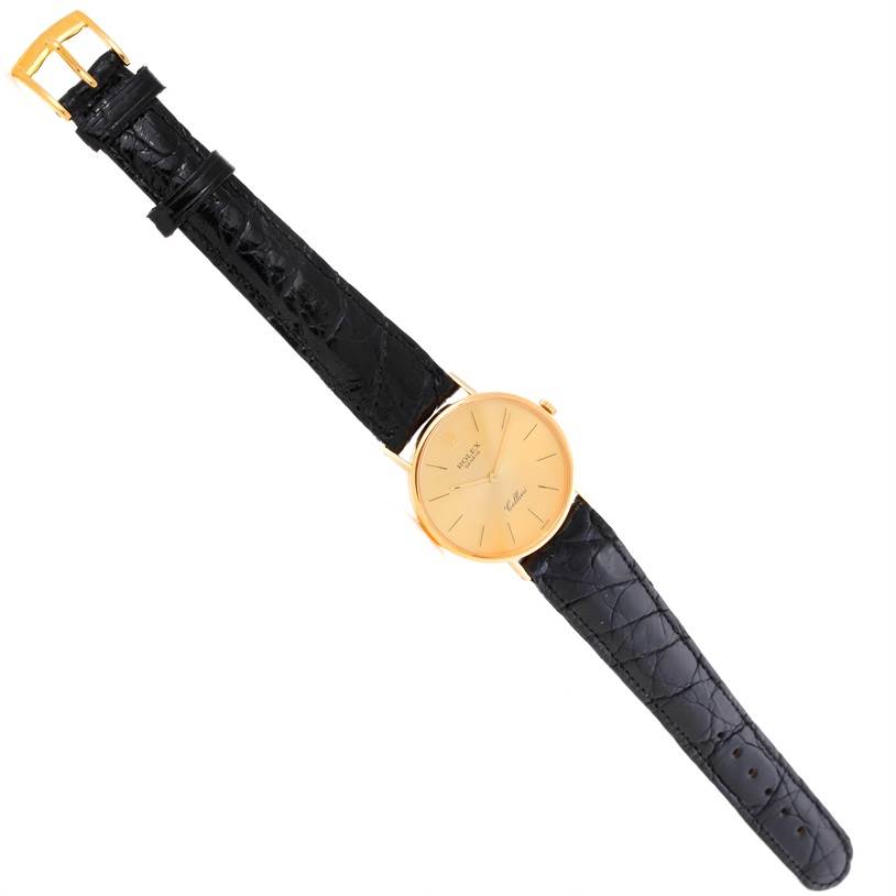 The image shows a full frontal view of a Rolex Cellini 5112 Men
s Yellow Gold Champagne Dial 5112 Men
s Yellow Gold Champagne Dial watch with a black leather strap and gold case.