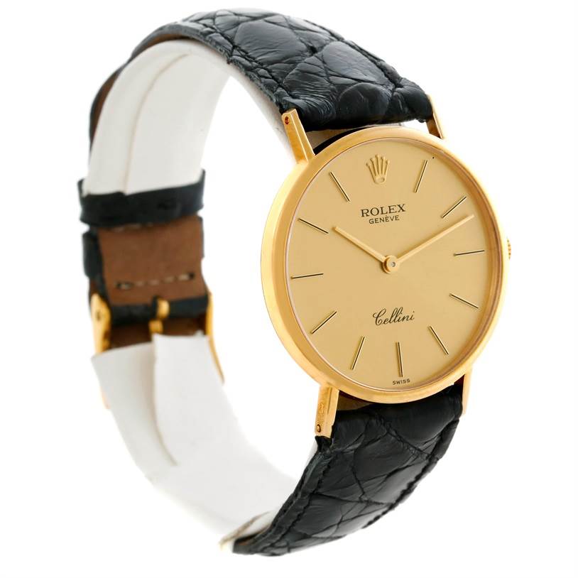 The Rolex Cellini 5112 Men
s Yellow Gold Champagne Dial 5112 Men
s Yellow Gold Champagne Dial watch is shown at a slight angle, displaying its gold face, black leather strap, and simple markers.