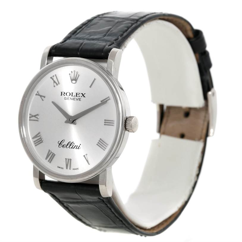 The image showcases a Rolex Cellini 5115 Men
s White Gold Silver Dial 5115 Men
s White Gold Silver Dial watch angled to display the face, crown, and part of the strap.