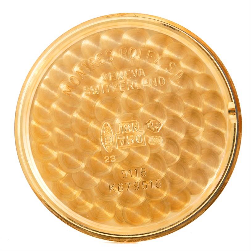 This image shows the interior case back of a Rolex Cellini 5116 Men's Yellow Gold Grey Dial 5116 Men's Yellow Gold Grey Dial watch, displaying its engravings and gold hallmark.