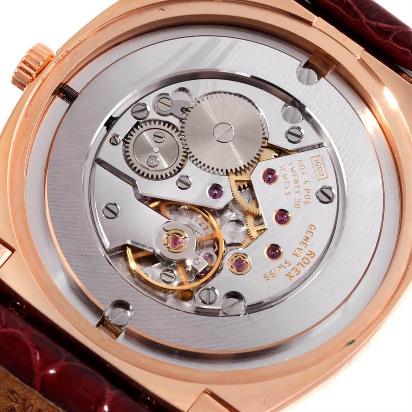 This image shows the movement of a Rolex Cellini 5330 Men's Rose Gold White Dial 5330 Men's Rose Gold White Dial watch from a rear, close-up angle, highlighting its intricate gears and mechanisms.