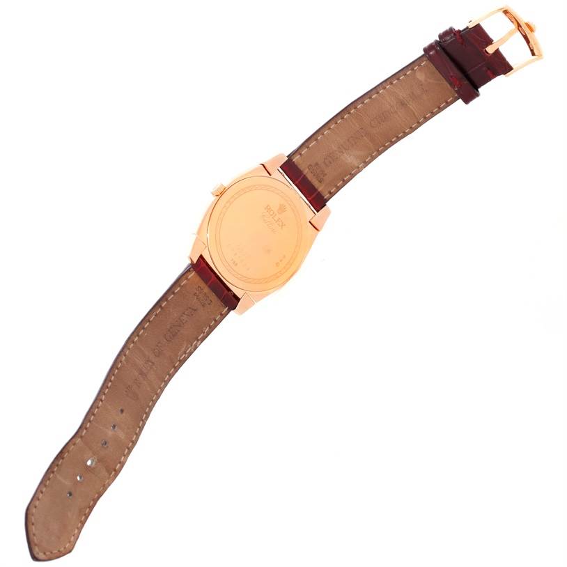 The image shows the back of a Rolex Cellini 5330 Men's Rose Gold White Dial 5330 Men's Rose Gold White Dial watch, including the leather strap and buckle.