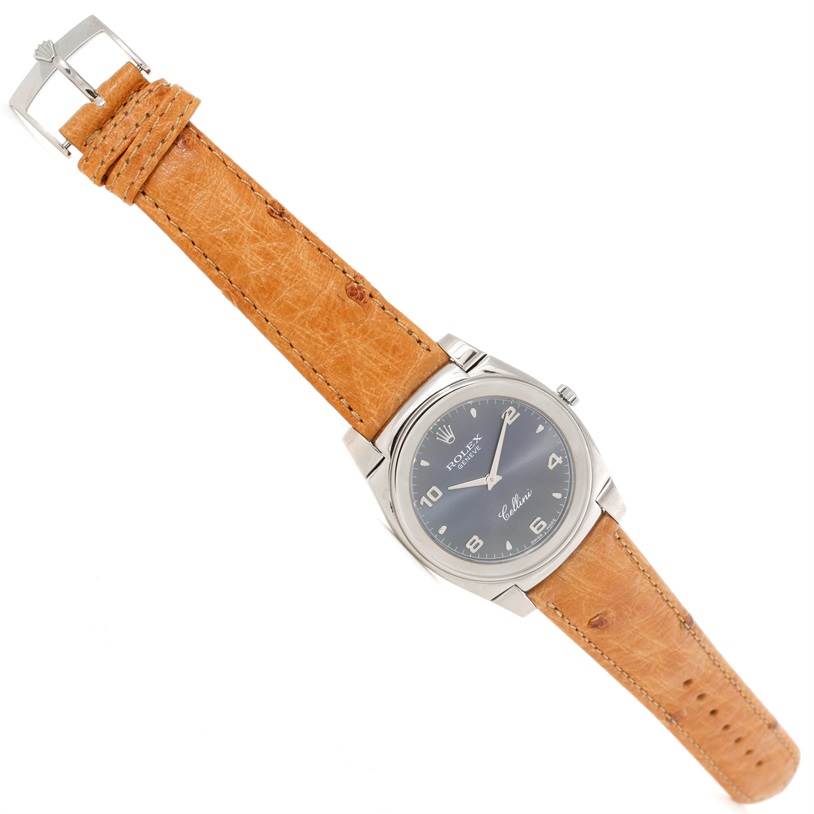 The Rolex Cellini 5330 Men's White Gold Grey Dial 5330 Men's White Gold Grey Dial watch is shown at a slight angle, displaying its face, tan leather strap, and metal buckle clasp.