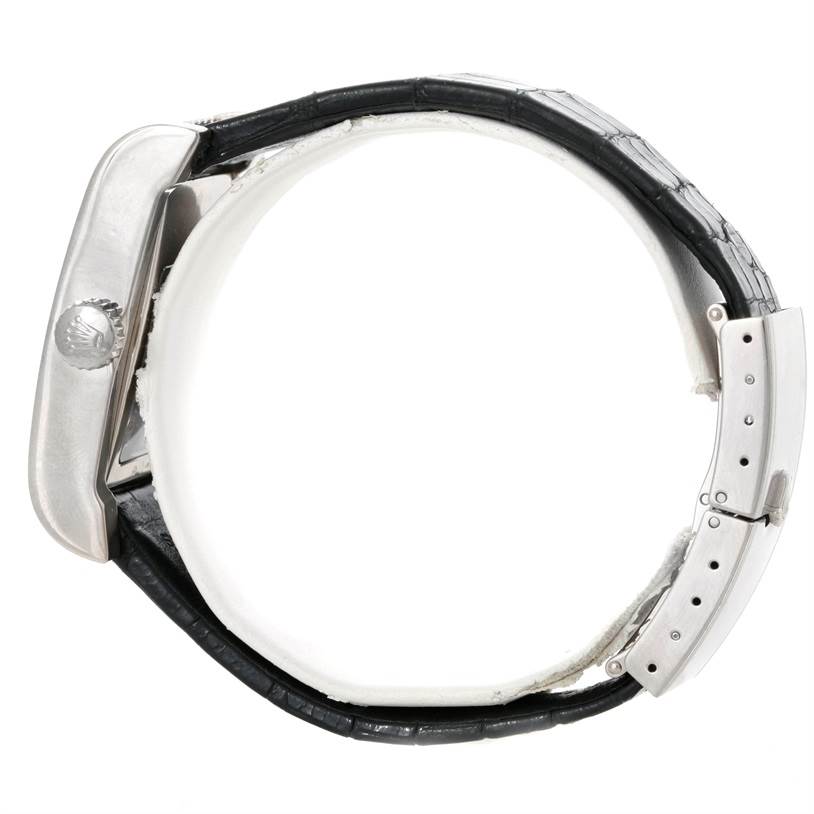 The image shows a Rolex Cellini 5441 Men's White Gold Silver Dial 5441 Men's White Gold Silver Dial watch from the side, focusing on the crown, case, and leather strap with a deployment clasp.