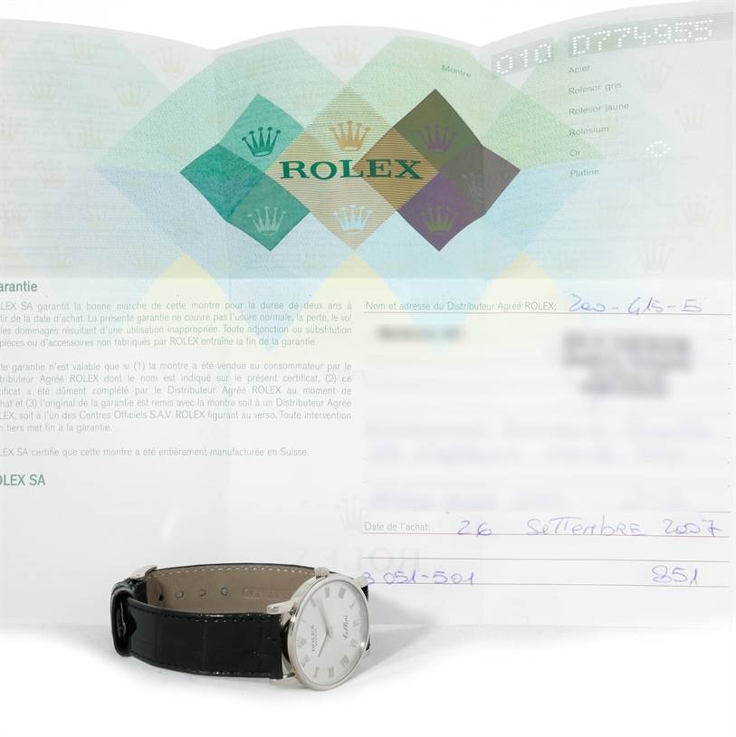 The watch shown is a Rolex Cellini 5115 Men's White Gold Silver Dial 5115 Men's White Gold Silver Dial model, captured from a side angle, with its certificate of authenticity in the background.