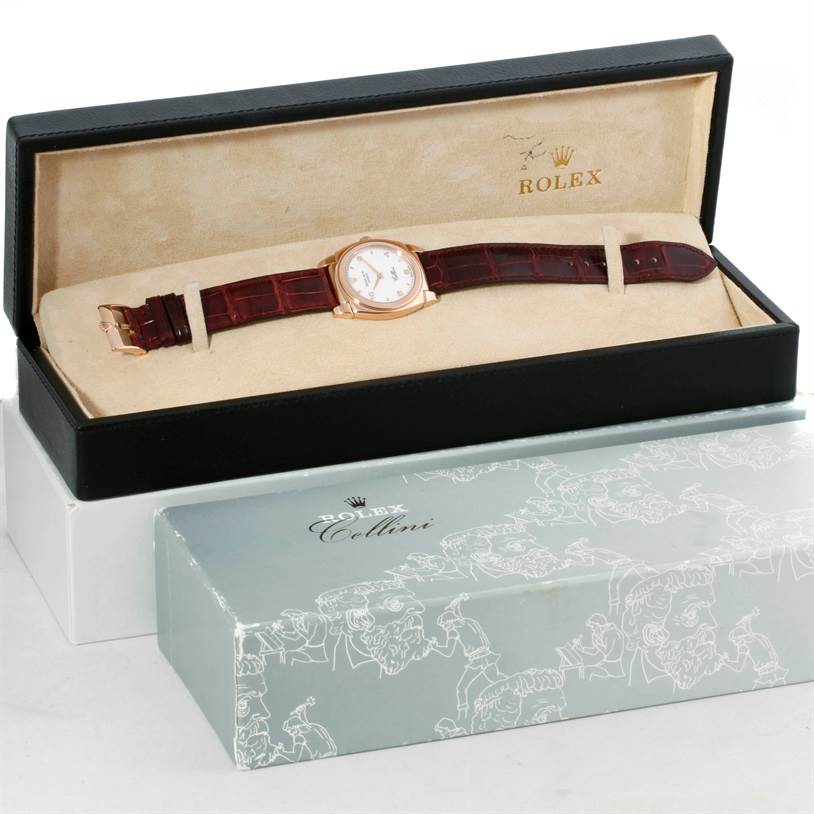 The Rolex Cellini 5320 Rose Gold White Dial 5320 Rose Gold White Dial watch is displayed inside its open black box, revealing the watch's face, strap, and buckle.