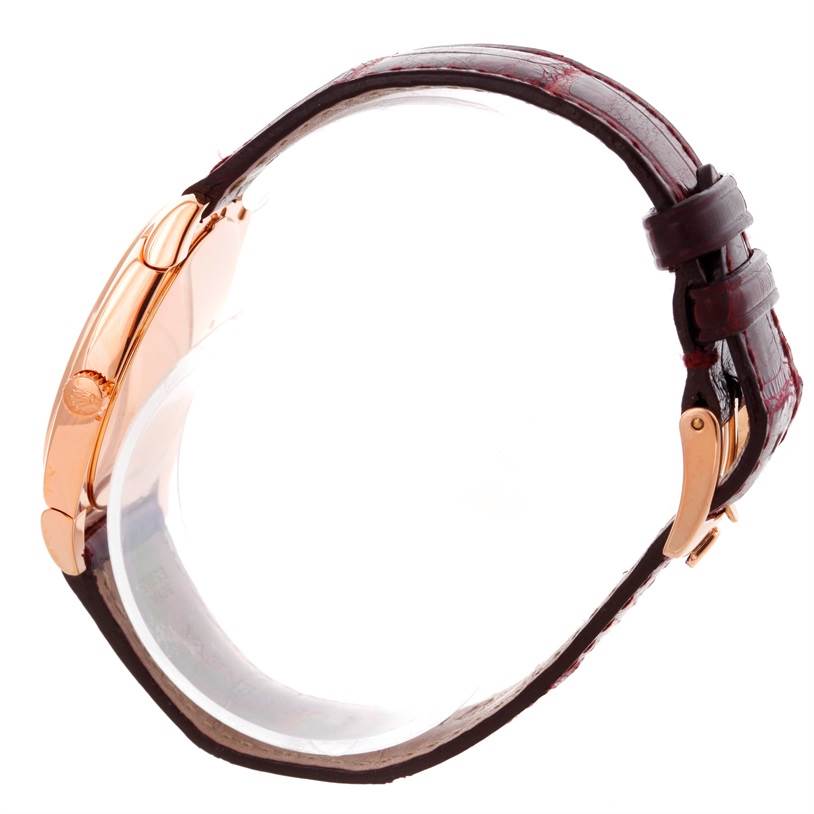 This image shows a side view of a Rolex Cellini 5320 Rose Gold White Dial 5320 Rose Gold White Dial watch, highlighting its rose gold case and brown leather strap.