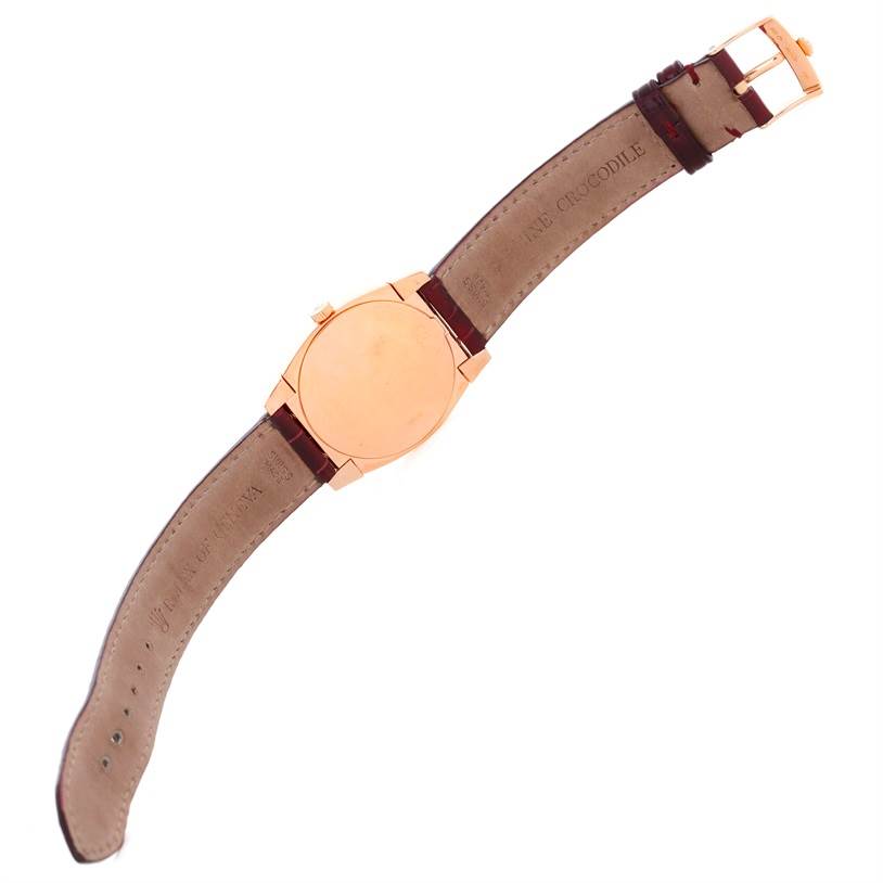 The Rolex Cellini 5320 Rose Gold White Dial 5320 Rose Gold White Dial watch is shown from the back, highlighting the case, buckle, and leather strap.