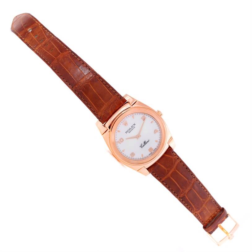 The image shows a Rolex Cellini 5330 Men's Rose Gold White Dial 5330 Men's Rose Gold White Dial watch at a top-down angle, displaying its face, leather strap, buckle, and case.