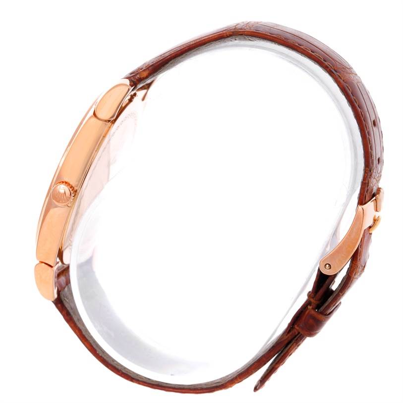 The image shows a side view of a Rolex Cellini 5330 Men's Rose Gold White Dial 5330 Men's Rose Gold White Dial model watch, highlighting the crown, case, and leather strap with clasp.