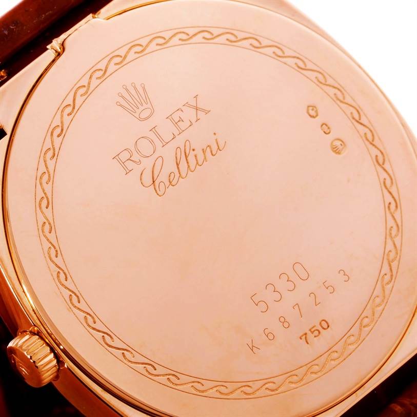 The image shows the back case of a Rolex Cellini 5330 Men's Rose Gold White Dial 5330 Men's Rose Gold White Dial watch from a close-up angle, highlighting its engravings and crown.