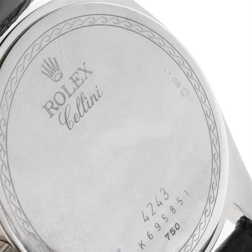 The image shows the back case of a Rolex Cellini 4243 Men's White Gold Black Dial 4243 Men's White Gold Black Dial watch, featuring engraved details and serial numbers.