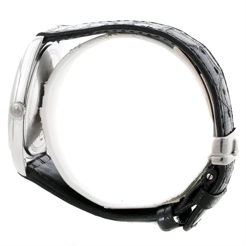 The image shows the Rolex Cellini 4243 Men's White Gold Black Dial 4243 Men's White Gold Black Dial watch from a side view, highlighting its case, crown, and leather strap.