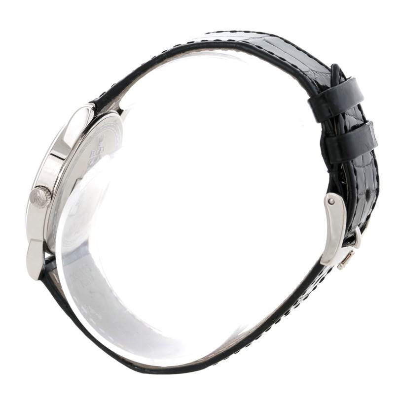 This image shows a side profile of a Rolex Cellini 5116 Men's White Gold Silver Dial 5116 Men's White Gold Silver Dial watch, highlighting the crown, case, and black leather strap with buckle.