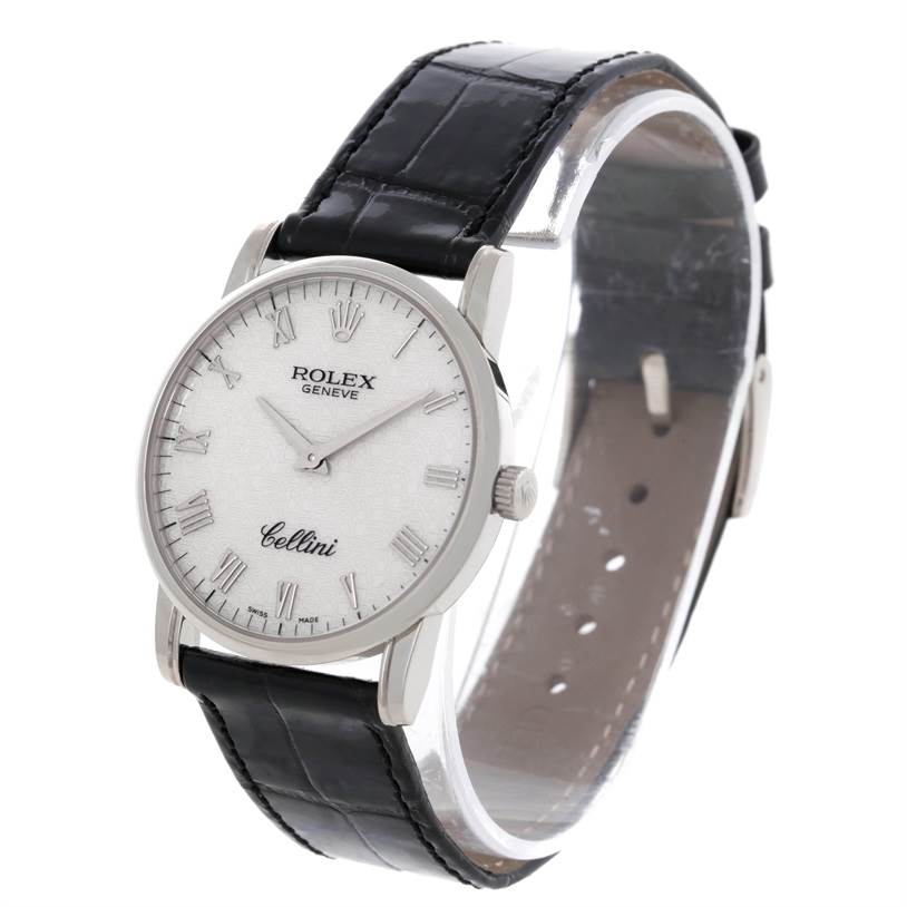 The Rolex Cellini 5116 Men's White Gold Silver Dial 5116 Men's White Gold Silver Dial watch is shown at a slight angle, highlighting its face, Roman numerals, and black leather strap.