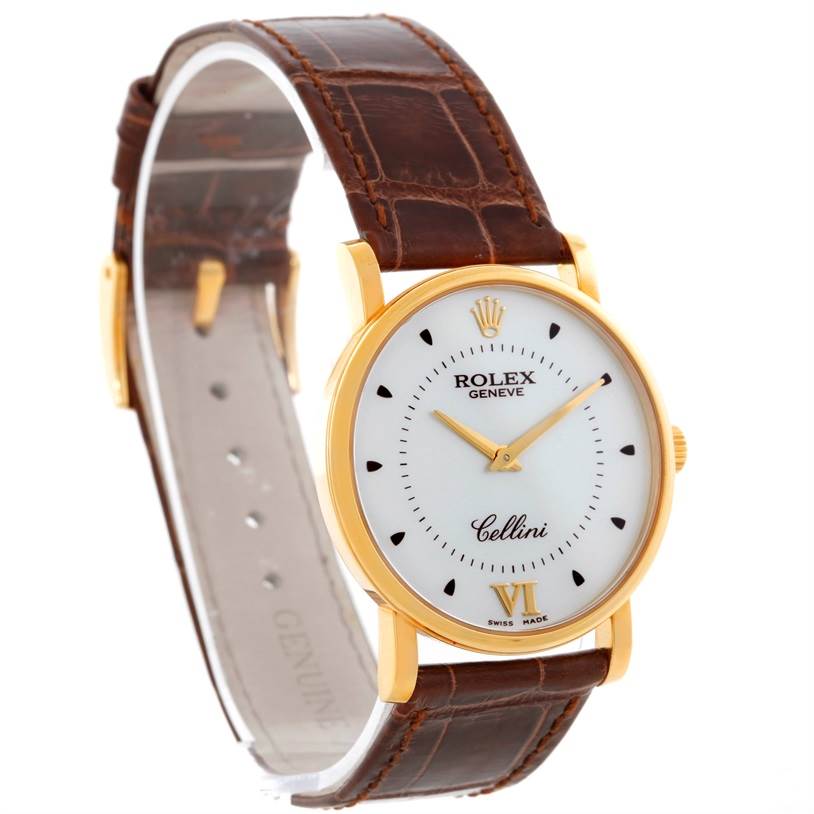 The Rolex Cellini 5115 Men
s Yellow Gold Silver Dial 5115 Men
s Yellow Gold Silver Dial watch is shown at an angle highlighting the dial, gold case, and brown leather strap.