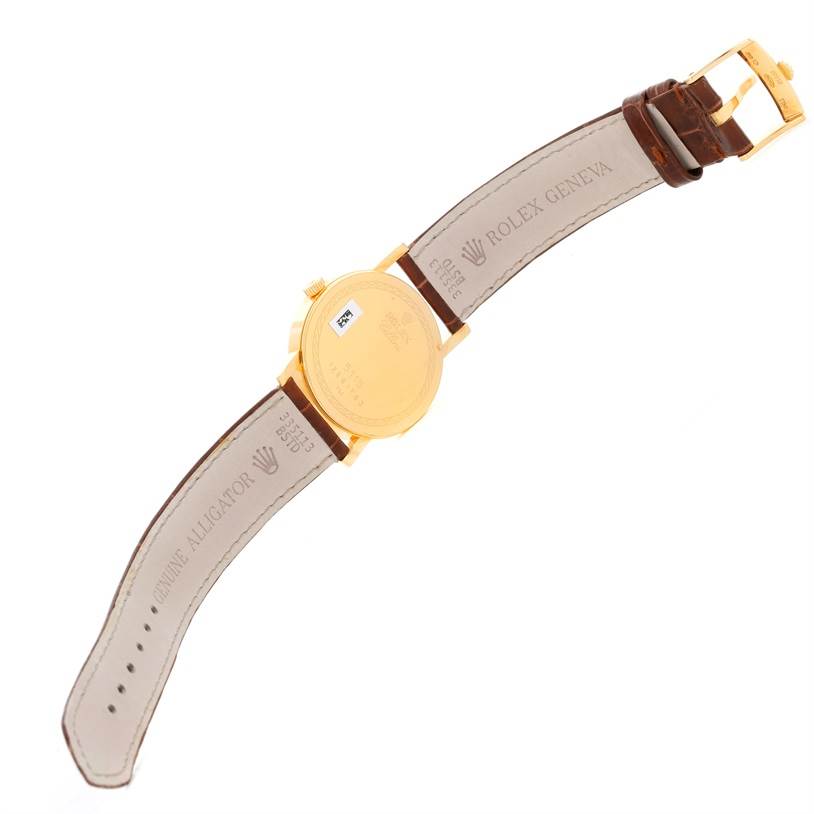 This image shows the back and leather strap of a Rolex Cellini 5115 Men
s Yellow Gold Silver Dial 5115 Men
s Yellow Gold Silver Dial watch in a top-down view.