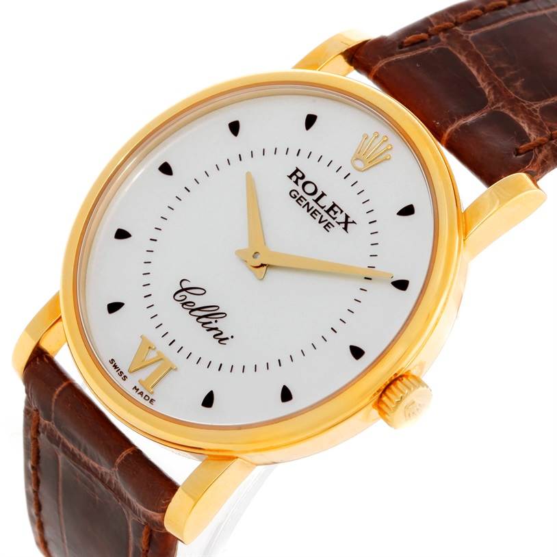 The Rolex Cellini 5115 Men
s Yellow Gold Silver Dial 5115 Men
s Yellow Gold Silver Dial watch is shown at a slight angle, highlighting the face, crown, and part of the leather strap.