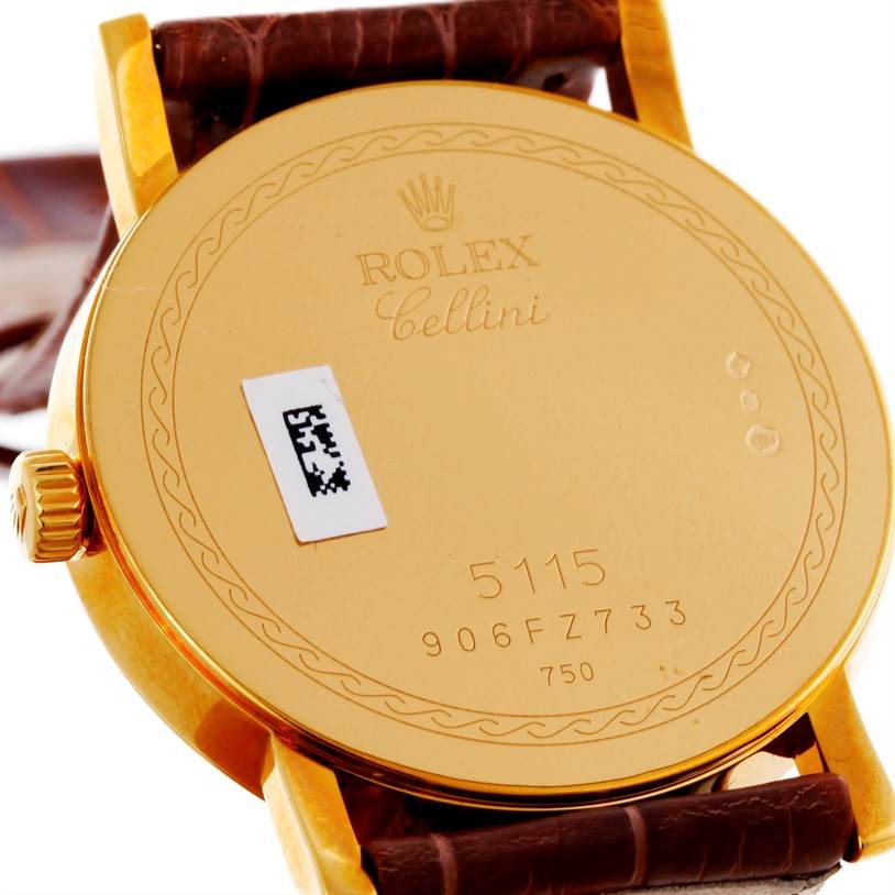 The image shows the back of a Rolex Cellini 5115 Men's Yellow Gold Grey Dial 5115 Men's Yellow Gold Grey Dial model watch, highlighting the caseback, crown, and part of the leather strap.