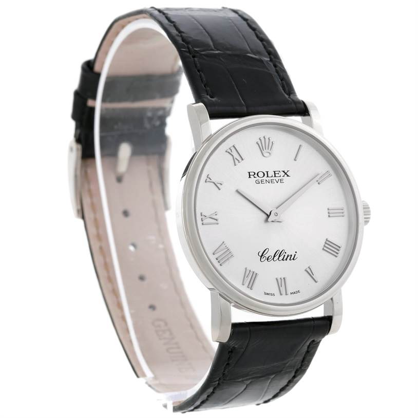 This Rolex Cellini 5115 Men
s White Gold Silver Dial 5115 Men
s White Gold Silver Dial watch is shown at an oblique angle highlighting the face, bezel, and black leather strap.
