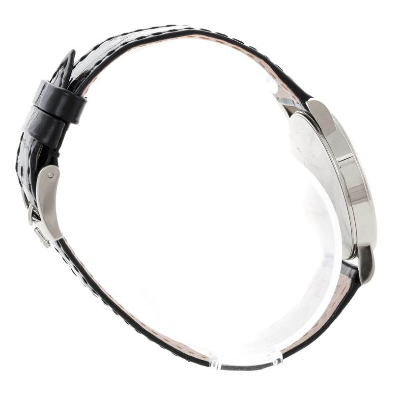 The image shows a side view of a Rolex Cellini 5115 Men
s White Gold Silver Dial 5115 Men
s White Gold Silver Dial watch, highlighting its leather strap and case.