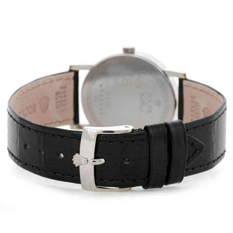 The image shows the back view of a Rolex Cellini 5115 Men
s White Gold Silver Dial 5115 Men
s White Gold Silver Dial watch, focusing on the black leather strap and its buckle.