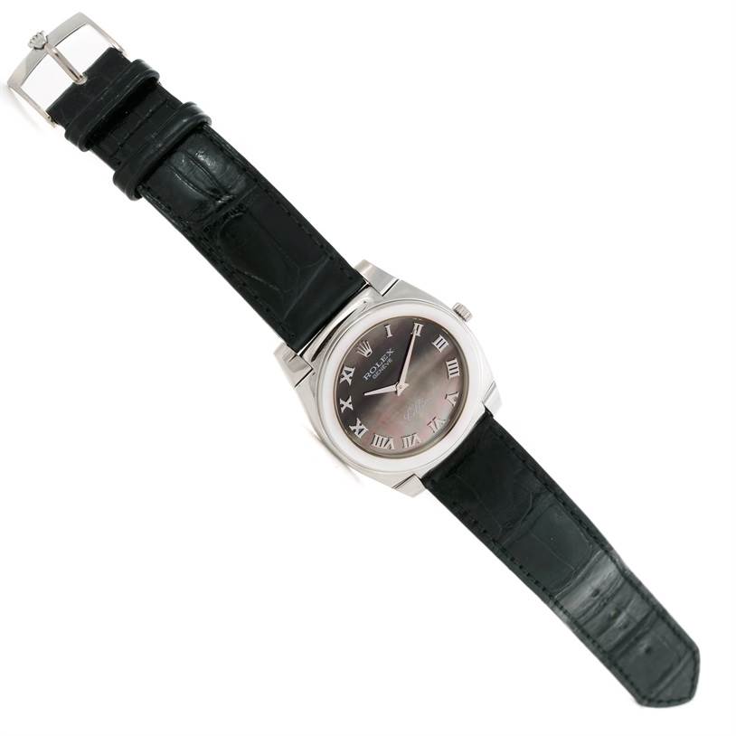 The Rolex Cellini 5330 Men's White Gold Mother of Pearl Dial 5330 Men's White Gold Mother of Pearl Dial watch is shown from a top-down angle, displaying the entire watch including its face, case, strap, buckle, and crown.