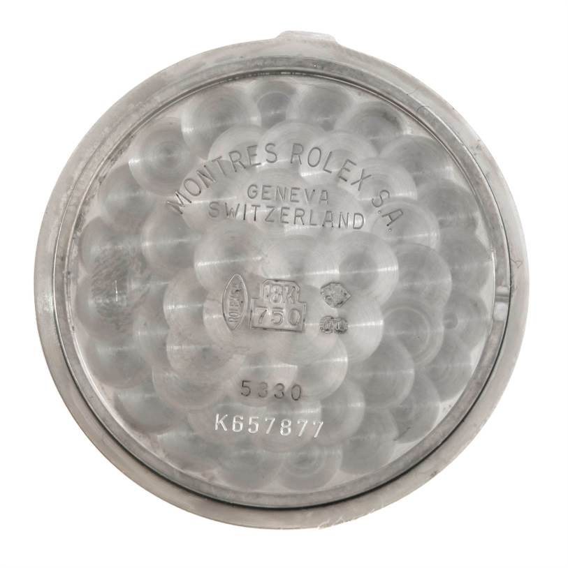 The image shows the interior case back of a Rolex Cellini 5330 Men's White Gold Mother of Pearl Dial 5330 Men's White Gold Mother of Pearl Dial watch, displaying various engravings and hallmarks.