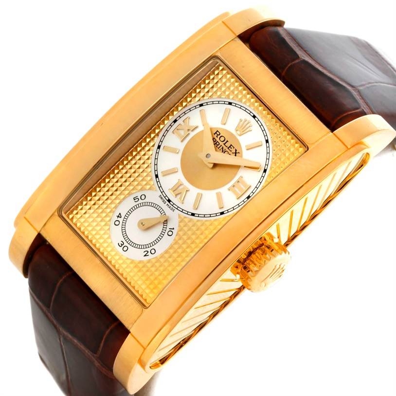 The image shows a close-up angled view of a Rolex Cellini 5440 Men's Yellow Gold Champagne Dial 5440 Men's Yellow Gold Champagne Dial watch featuring its rectangular gold-tone case, dial, crown, and brown leather strap.