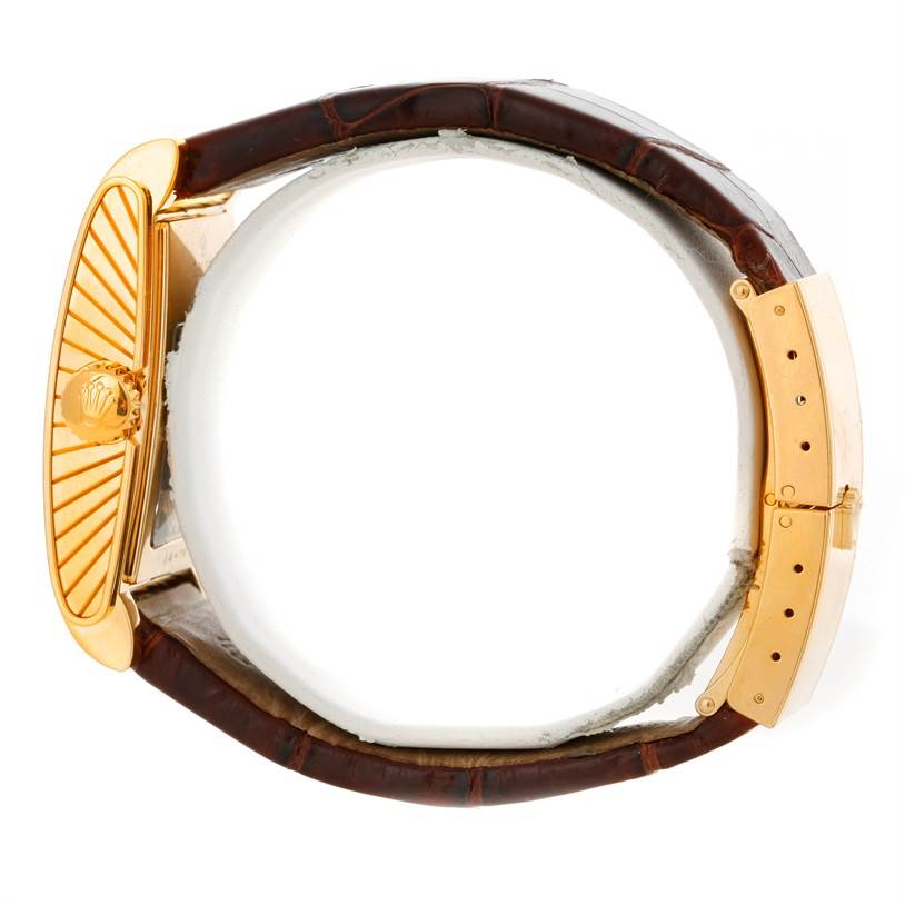 The image shows a Rolex Cellini 5440 Men's Yellow Gold Champagne Dial 5440 Men's Yellow Gold Champagne Dial watch from a side angle, highlighting its brown leather strap and gold clasp.