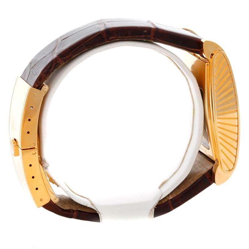 Side view of a Rolex Cellini 5440 Men's Yellow Gold Champagne Dial 5440 Men's Yellow Gold Champagne Dial watch showing the brown leather strap and gold clasp.