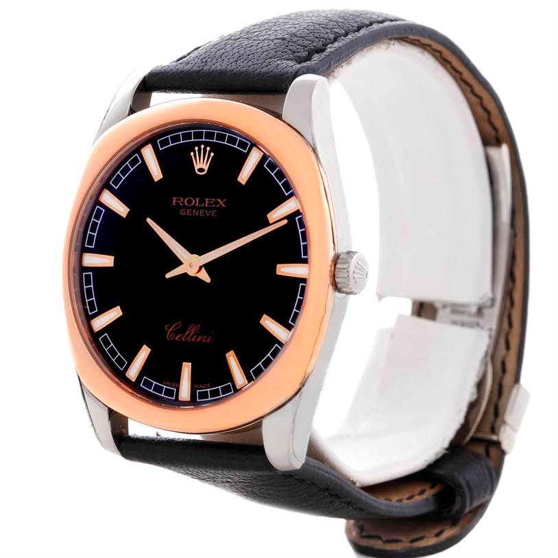 The image shows a Rolex Cellini Men's White Gold Black Dial Men's White Gold Black Dial watch from a three-quarter angle, highlighting its black dial, rose gold bezel, and black leather strap.