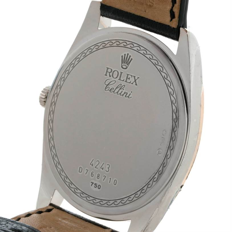 This image shows the back of a Rolex Cellini Men's White Gold Black Dial Men's White Gold Black Dial watch, highlighting the case back and partially the leather strap.