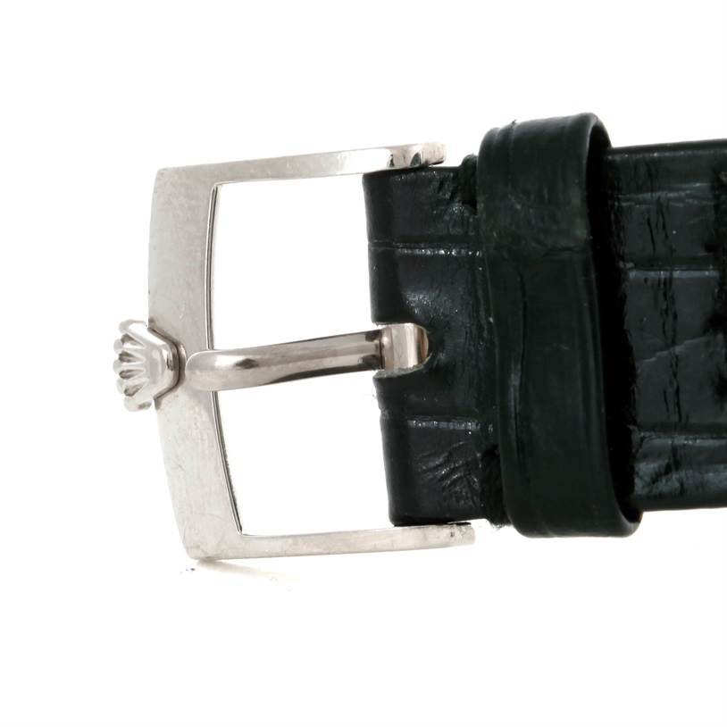 This image shows a close-up view of the buckle and leather strap of a Rolex Cellini 5116 Men's White Gold Black Dial 5116 Men's White Gold Black Dial watch.