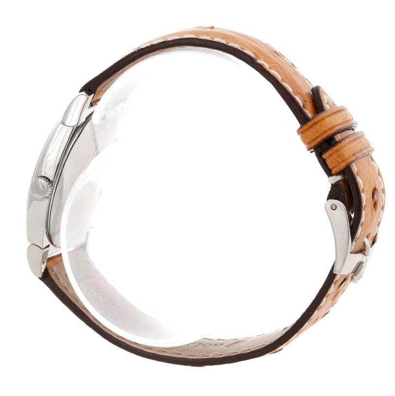 This side angle of the Rolex Cellini 5320 Men's White Gold White Dial 5320 Men's White Gold White Dial watch shows the crown, case, and tan leather strap.