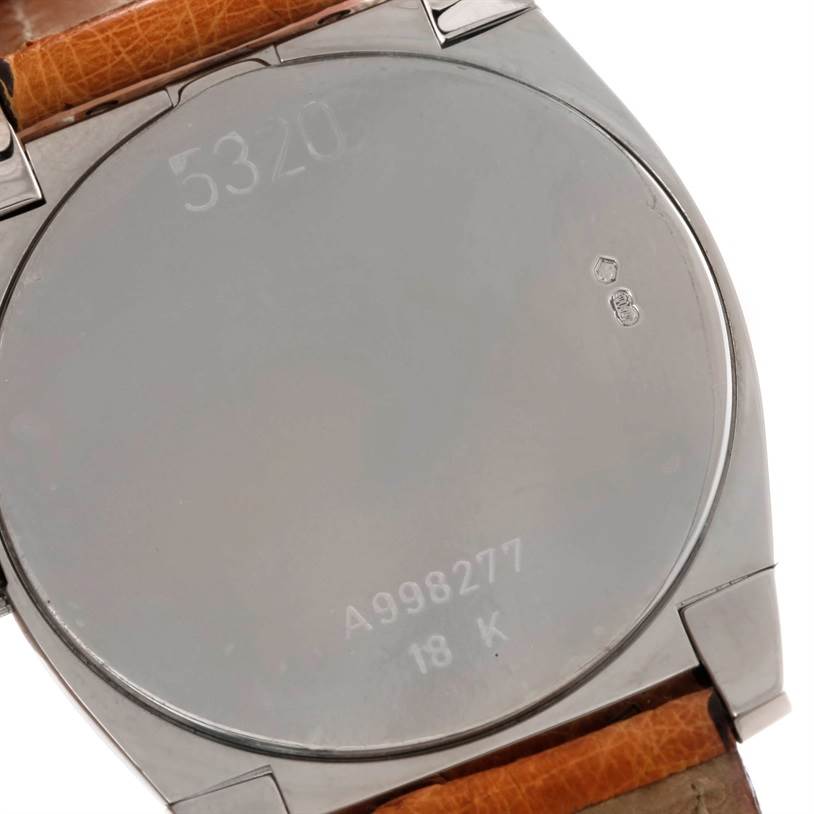 The image shows the case back of a Rolex Cellini 5320 Men's White Gold White Dial 5320 Men's White Gold White Dial watch, displaying the engravings and part of the leather strap.