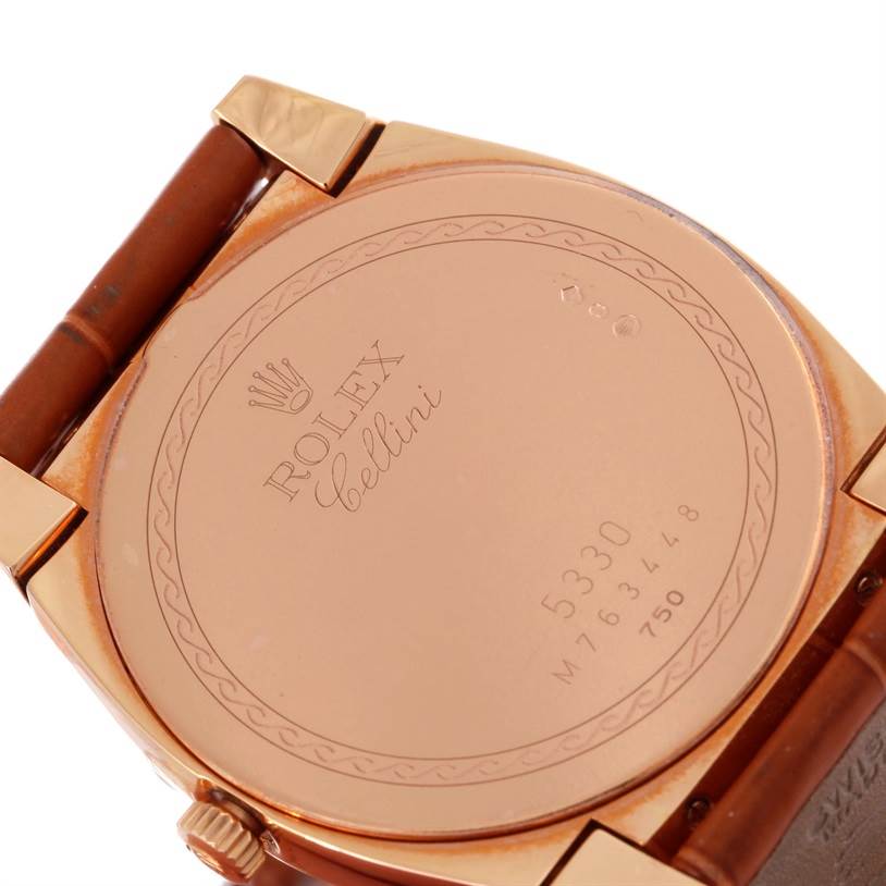 This image shows the back case and part of the strap of a Rolex Cellini 5330 Men's Rose Gold White Dial 5330 Men's Rose Gold White Dial watch at an angled close-up view.