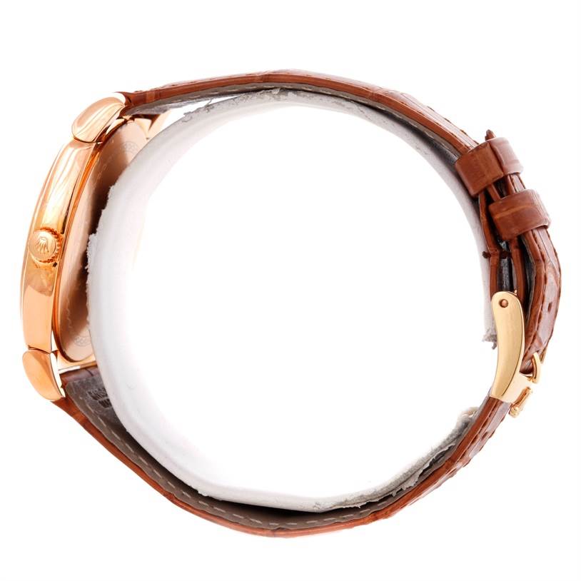 The angle shows a side view of the Rolex Cellini 5330 Men's Rose Gold White Dial 5330 Men's Rose Gold White Dial watch, highlighting its crown, case, and leather strap.