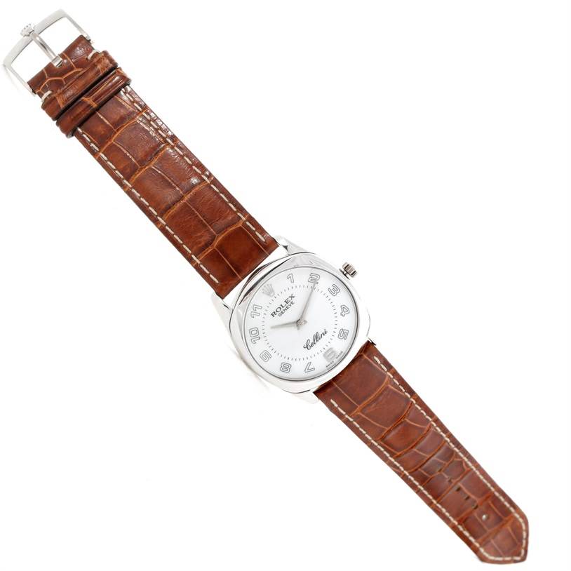 The image shows a top view of a Rolex Cellini 4233 Men's White Gold White Dial 4233 Men's White Gold White Dial watch with a brown leather strap and silver-tone case.